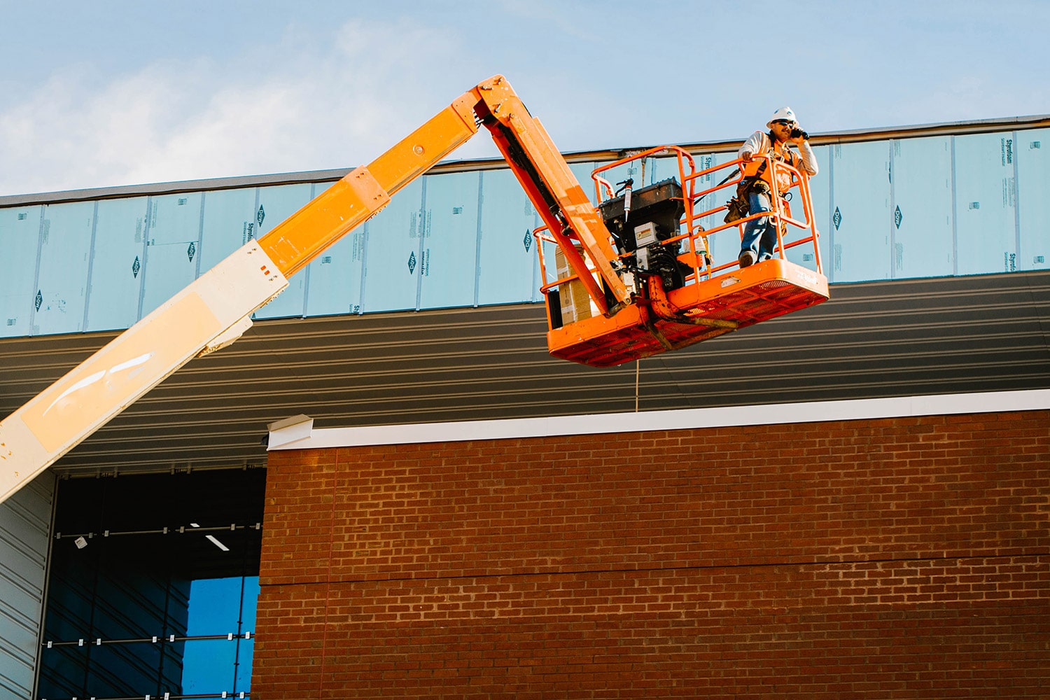 Man in lift at a construction site