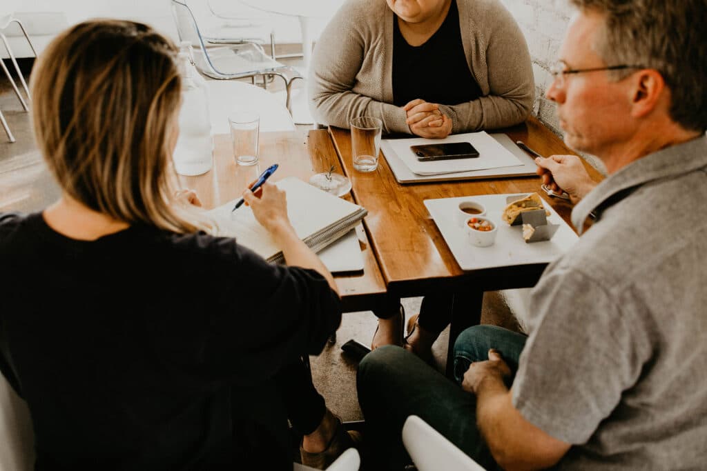 Three people at lunch meeting